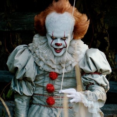 Forum avatar of Pennywise from the movie It (2017): grinning clown in a ruffled white costume with red pom-poms.