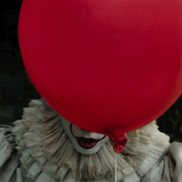 A sinister clown with a red balloon obscuring its face, inspired by the horror film It (2017), makes a chilling forum avatar that captures the essence of the genre.