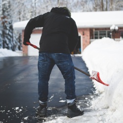 Guy cleans snow by Filip Mroz