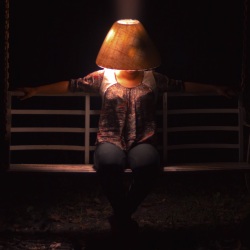 Woman with a lamp on her head by Cristian Newman