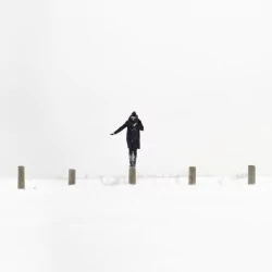  Woman standing on column by Matthew Henry