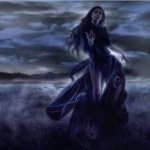 Dark gothic forum avatar/pfp: a lone, long-haired figure in a flowing black dress stands in moonlit mist over a windswept field, wind-tossed hair and a brooding, shadowed atmosphere.