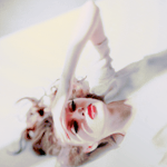 Beautiful woman with soft lighting and a dreamy expression, featured as a forum avatar or profile photo.