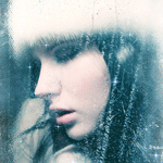 Close-up profile of a woman's face in soft, moody lighting with a frosted glass effect — a forum avatar/profile photo.