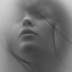 Close-up profile photo of a woman's face with soft, blurred edges, used as a forum avatar.