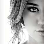 Black-and-white close-up of a woman's face used as a forum avatar/profile photo, showing one eye, part of her lips and wavy hair.