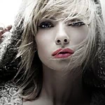 Forum avatar: close-up portrait of a blonde woman with glamorous, celebrity-inspired styling — bold red lips, tousled hair and an intense, smoldering gaze.
