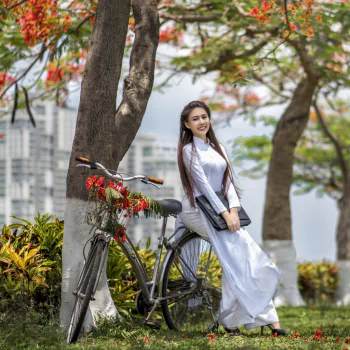 long hair brunette white dress smile bicycle asian model woman PFP