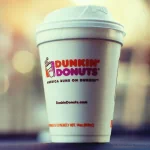 A profile photo featuring a Dunkin' Donuts cup, capturing a warm beverage with the brand logo prominently displayed, set against a soft, blurred background.
