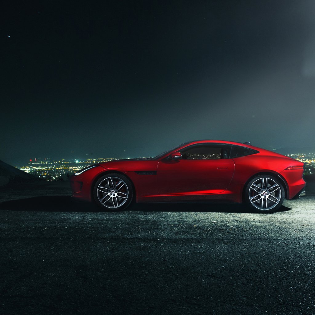 Forum profile avatar of a red Jaguar F-Type sports car parked at night on a hillside with city lights glowing on the horizon.