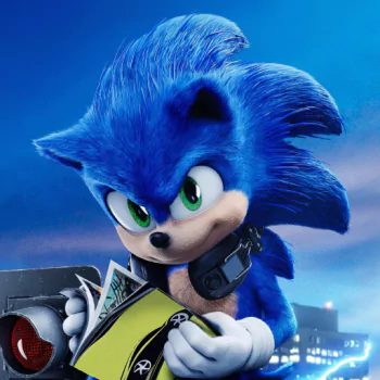 Forum avatar of Sonic the Hedgehog (movie): close-up of blue Sonic with green eyes and a metal collar, clutching a comic/book while a lit city skyline glows behind him.
