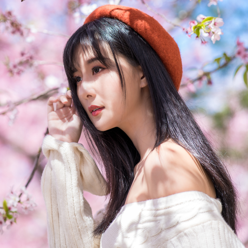 Asian Girl near Sakura Tree