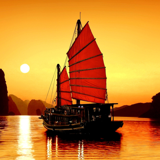 Sailboat at Sunset on Ha Long Bay in Vietnam