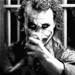 A striking forum avatar featuring the Joker from *The Dark Knight Rises*, showcasing his iconic makeup and sinister grin against a dark, moody background.