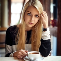 Blonde model drinking coffee by Alex Fetter