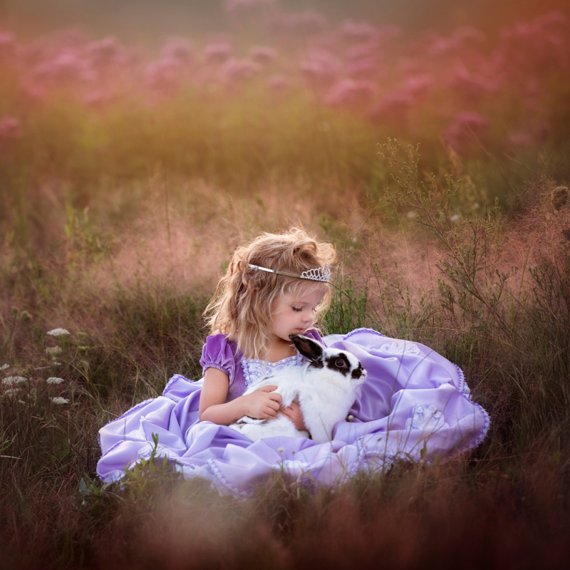 Little Girl Holding a Rabbit