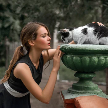 black dress mood depth of field cat ponytail brunette model woman PFP