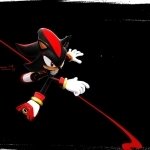 Forum avatar/profile photo: Shadow the Hedgehog from the Sonic the Hedgehog video game, leaping against a black background with red motion streaks.