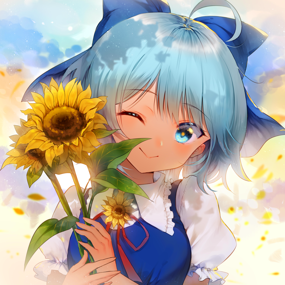 Anime-style avatar of Cirno from Touhou with blue hair and a large blue bow, winking while holding bright sunflowers against a soft, glowing background.