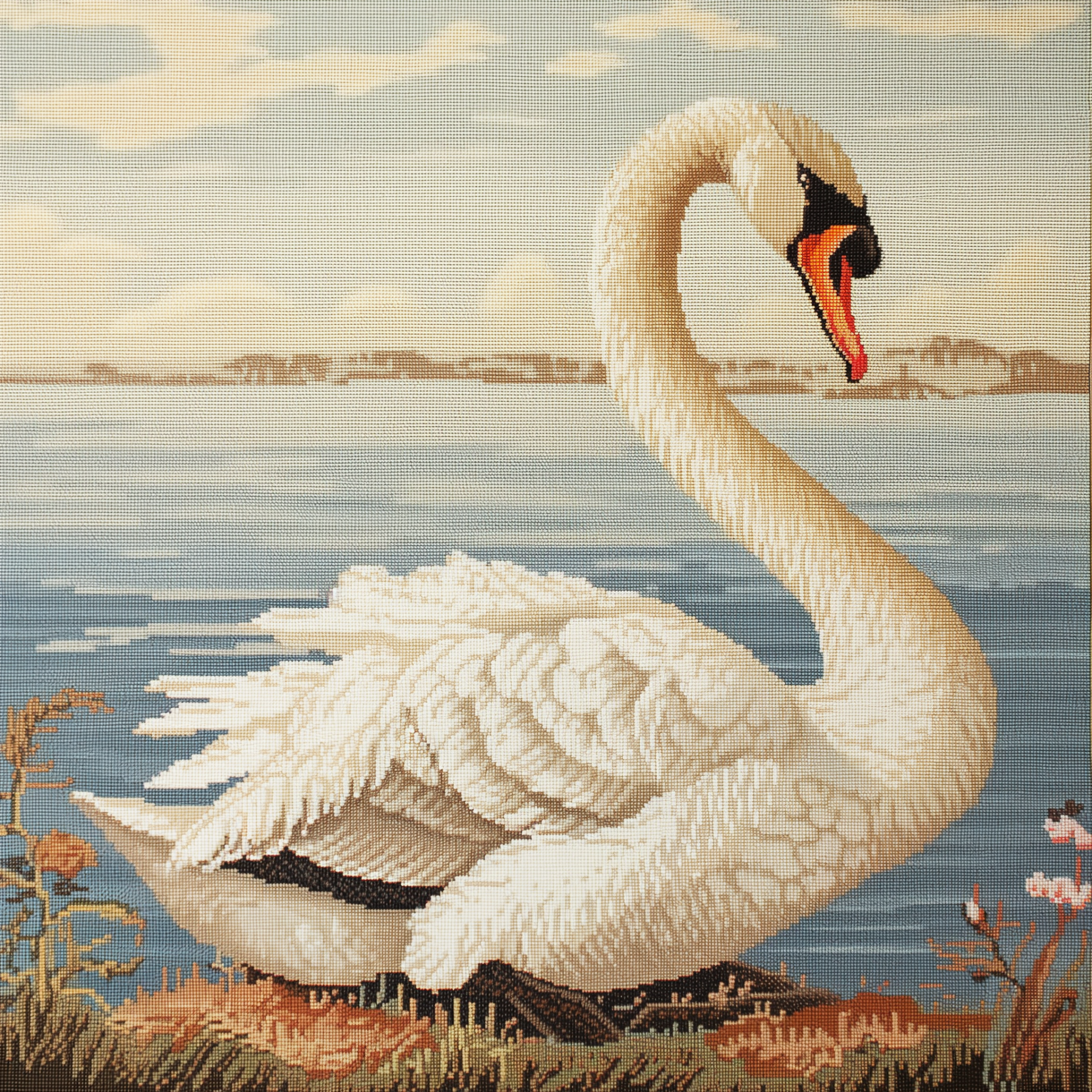 Needlepoint art avatar featuring a detailed mute swan by the water's edge.
