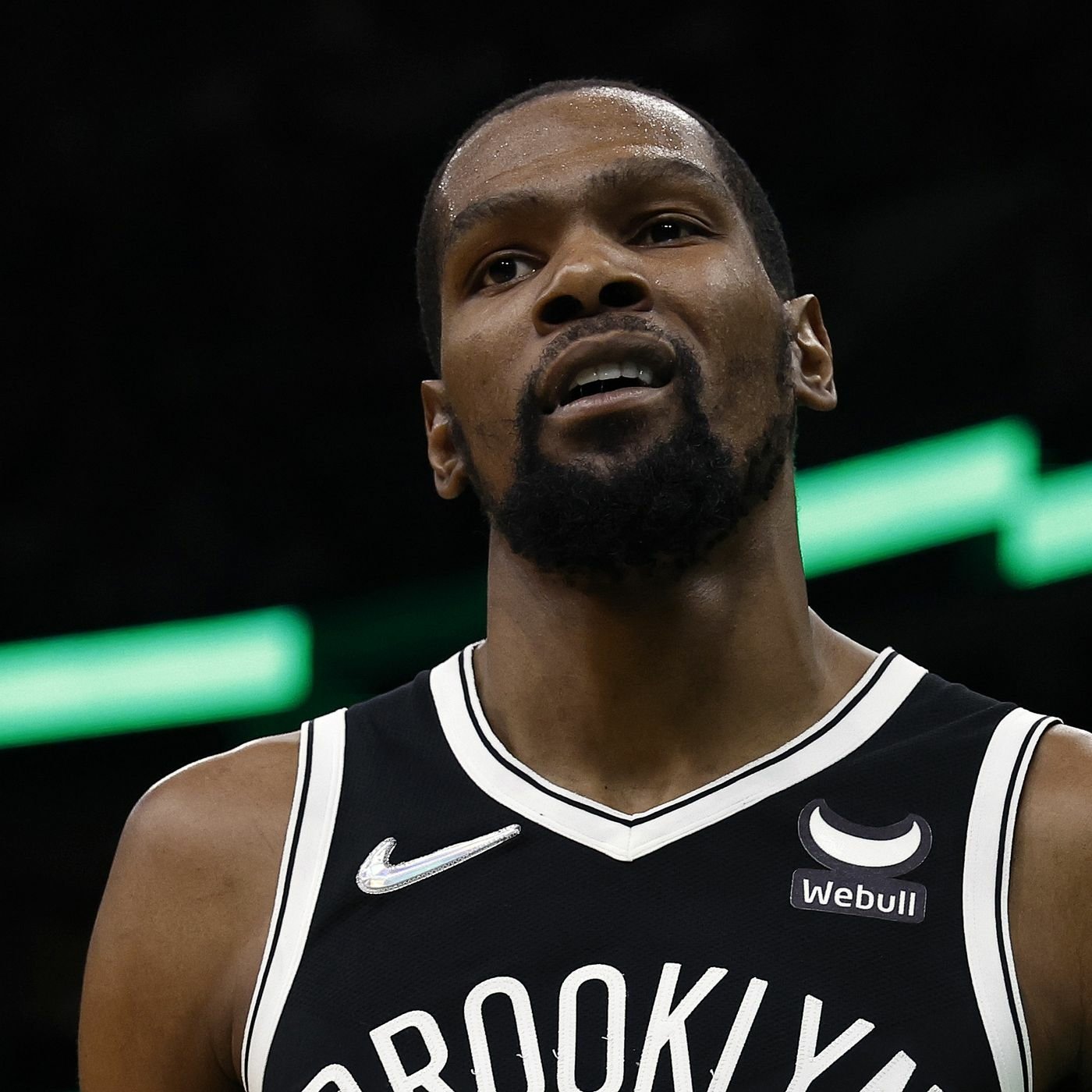 Profile photo of Kevin Durant, showcasing the Brooklyn Nets jersey. The image captures his intense expression, embodying his competitive spirit in the NBA.