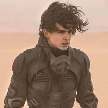 Avatar of a character from the movie Dune (2021) in a desert setting wearing a futuristic suit.