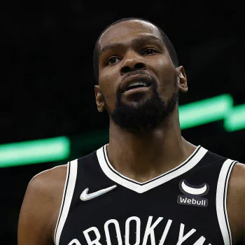 Profile photo of Kevin Durant, showcasing the Brooklyn Nets jersey. The image captures his intense expression, embodying his competitive spirit in the NBA.