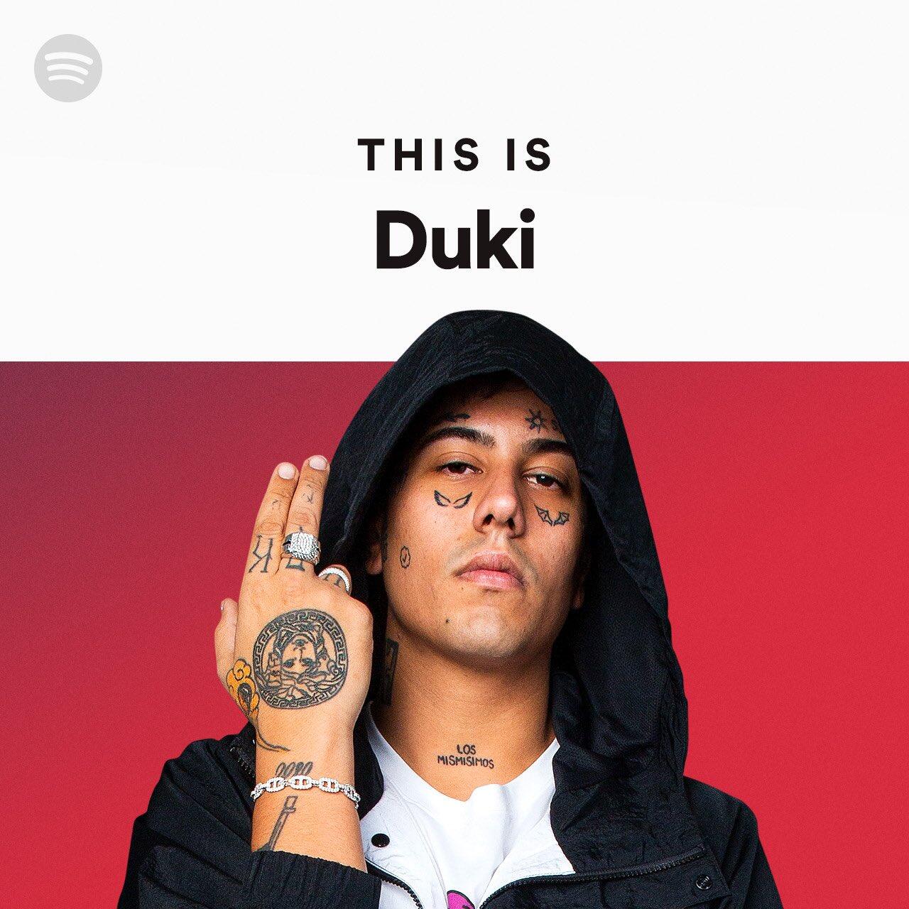Profile photo of the rapper Duki, featuring him in a black hoodie with tattoos and a confident pose, accompanied by the text THIS IS Duki.