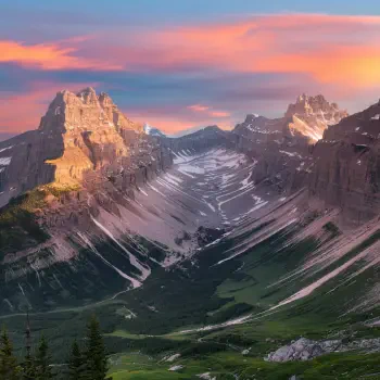 A stunning mountain landscape in Canada, featuring rugged peaks bathed in warm sunset hues and lush green valleys, ideal for a forum avatar or profile photo.
