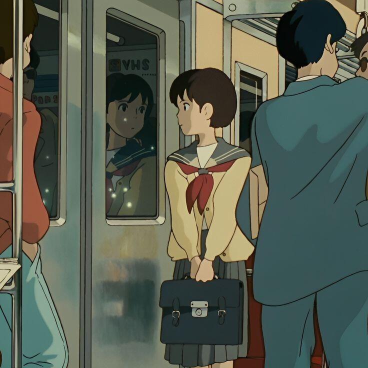 A scene from Studio Ghibli's Whisper of the Heart, featuring Shizuku Tsukishima on a subway platform, highlighting her introspective gaze amid bustling commuters.