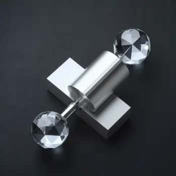 A sleek silver forum avatar features a minimalist design with a metallic central bar and two clear crystal-like spheres, creating a modern and elegant profile photo.