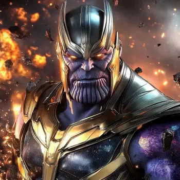 A close-up of Thanos, the iconic villain from the movie franchise, showcasing his menacing expression and detailed armor against a backdrop of destruction.