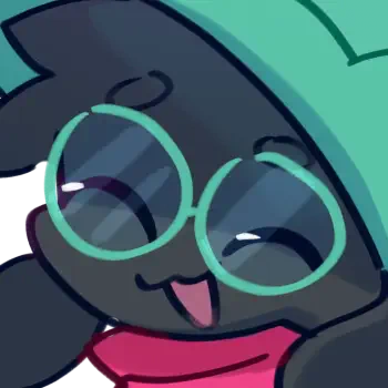 Close-up forum avatar of Ralsei from the video game Deltarune: smiling dark-furred character in a green hood with round teal glasses and a pink scarf, playful expression.