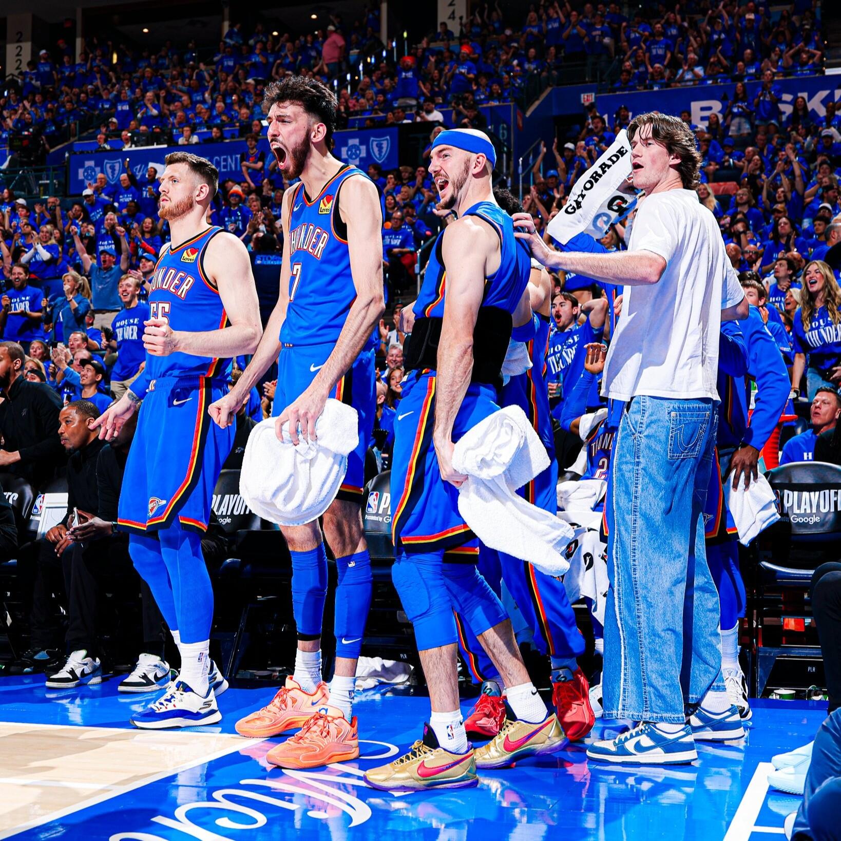 Forum avatar/profile photo of Oklahoma City Thunder NBA basketball team players in blue jerseys cheering on the bench during a game.