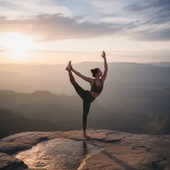 Forum avatar: person in a standing bow yoga pose on a cliff at sunrise, silhouetted against layered mountain valleys.