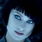 Digital avatar profile picture with striking blue eyes and a dark bob haircut in a moody blue setting.